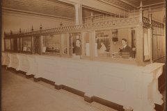 Figure 2.Sepia toned silver print of the interior of First National Bank, circa 1904. (2006.5.1).Margery Sylvester Collection. Sagadahoc History & Genealogy Room.